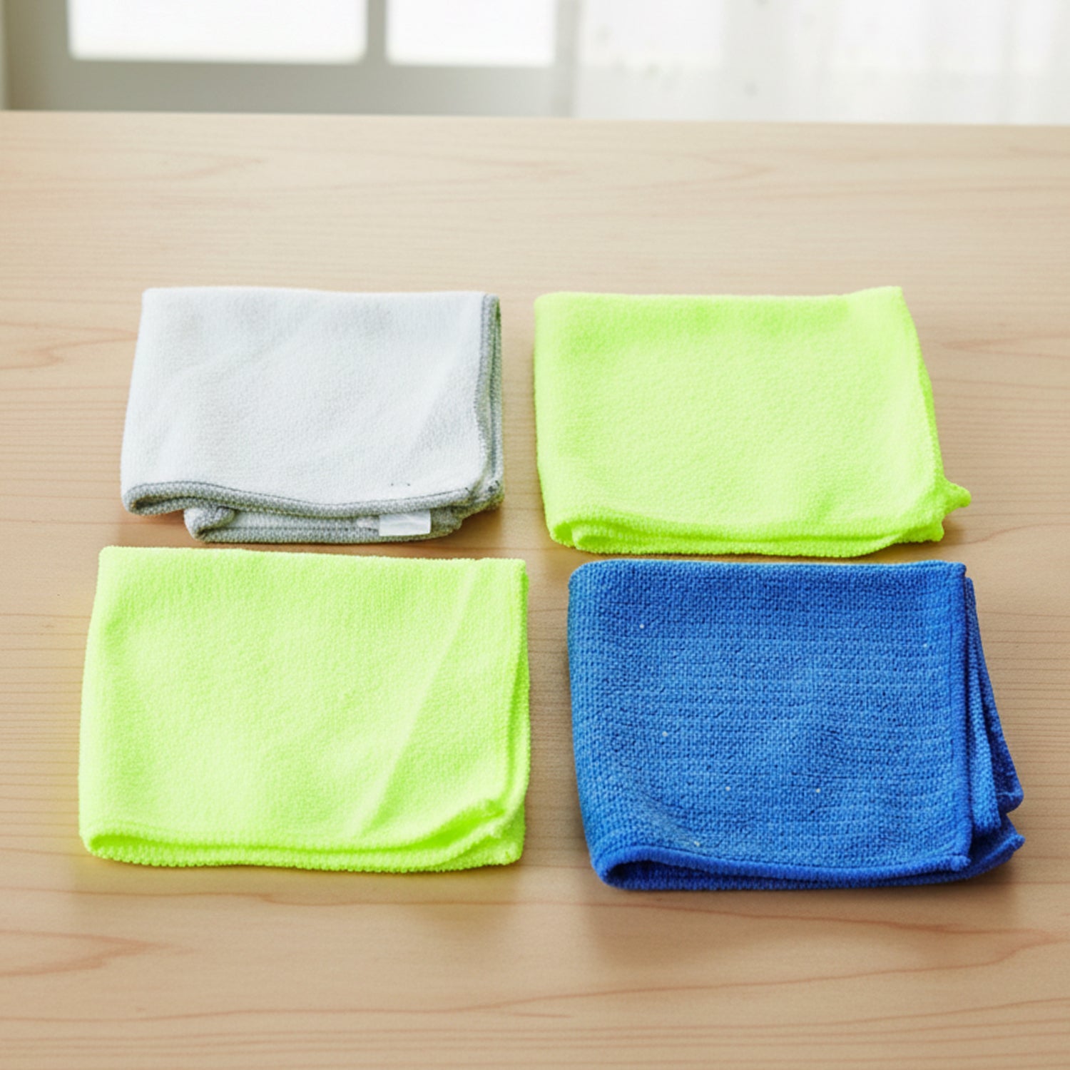 Neatly folded microfiber cloths on surface