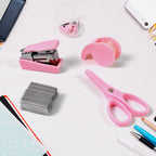 A clear plastic bottle containing a mini office stationery set, including a stapler, scissors, and tape dispenser.