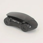 Stylish red sports car phone holder positioned on a car dashboard.
