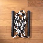 Neutral background image of fitness gear including skipping rope