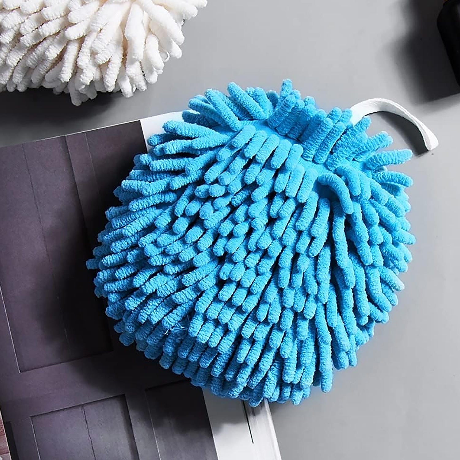 Hands drying quickly with a soft microfiber chenille hand towel.