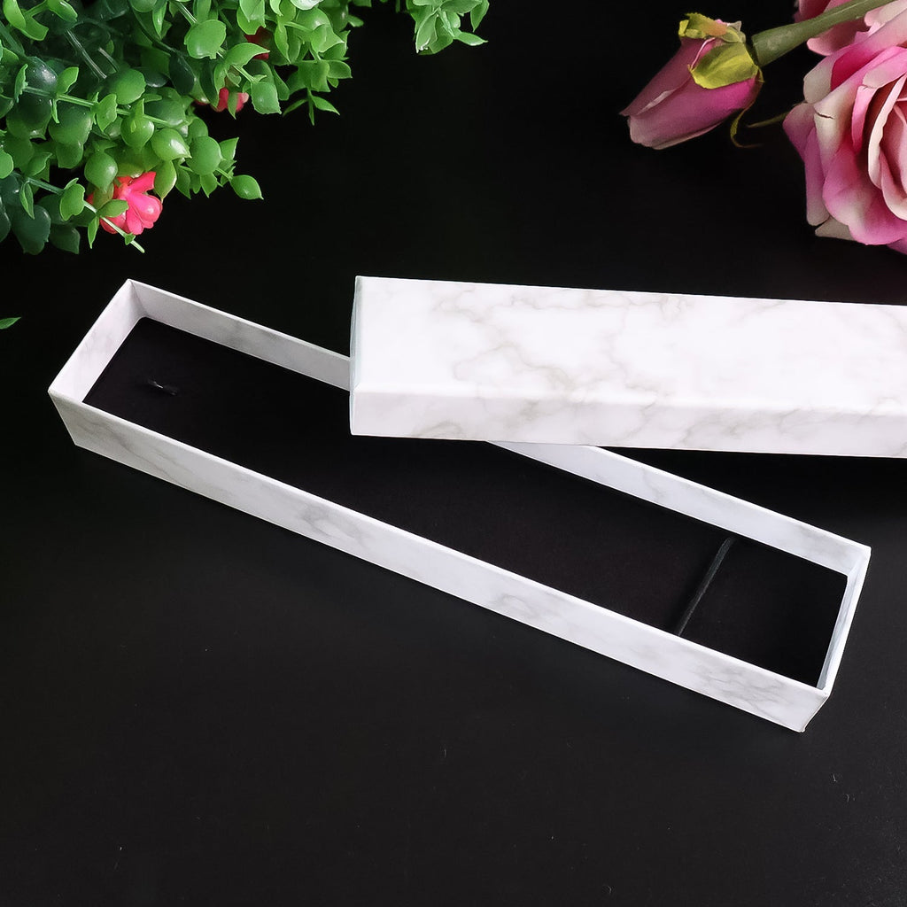 Elegant top-down view of the 21x5cm marble finish jewelry gift box, highlighting its design.