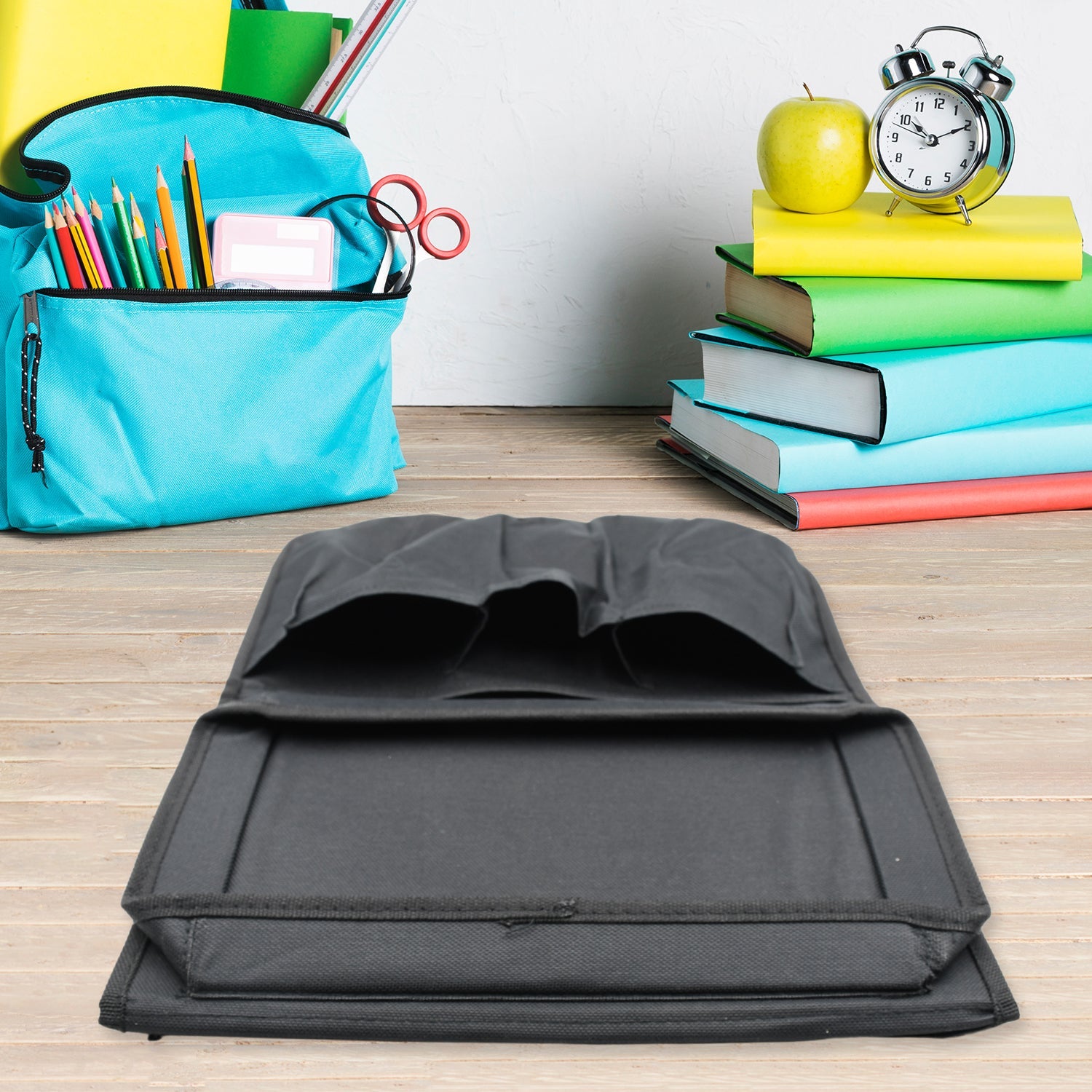 Top-down view of the sofa armrest organizer with a tray and various pockets.