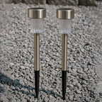 Weatherproof solar path light standing in a garden with green foliage