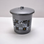 Detailed shot of the plastic bathroom accessories, emphasizing the quality and finish of the set.