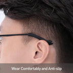 Anti-slip silicone eyeglass ear grips fitted on black-framed glasses, viewed from the side.