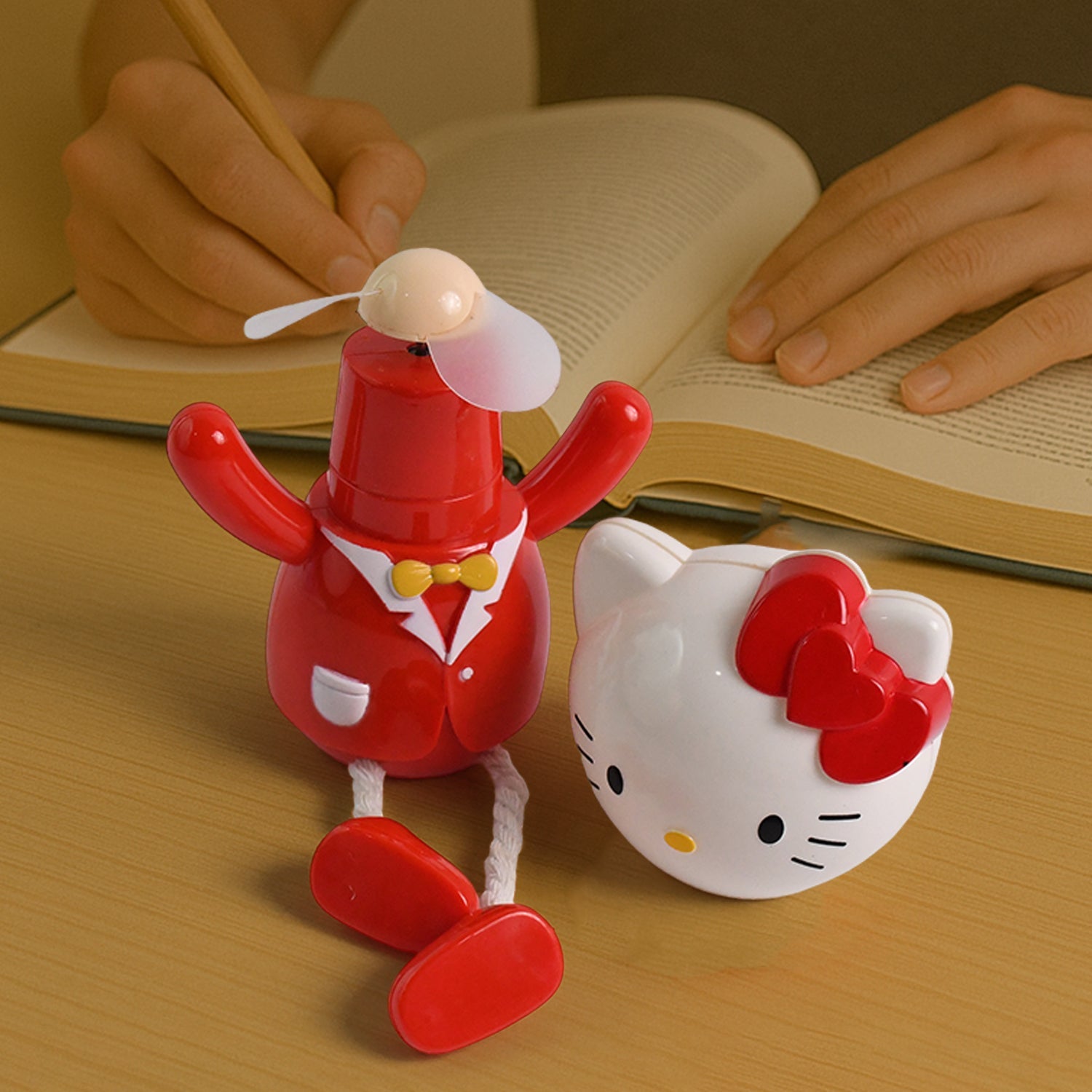USB cartoon mini table fan with kitty character and red suit on desk