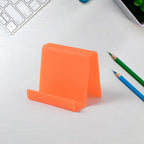 Compact plastic mobile phone stand set displayed on workspace