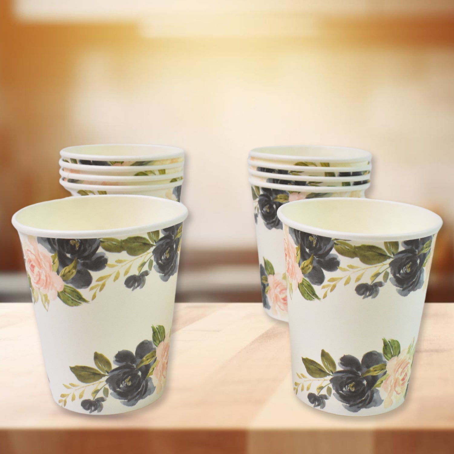 Assorted disposable paper cups in mixed colors and designs for beverages.