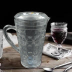 Angled view of the Mocktail PET Plastic Jug, highlighting its elegant diamond-cut design and clear material.