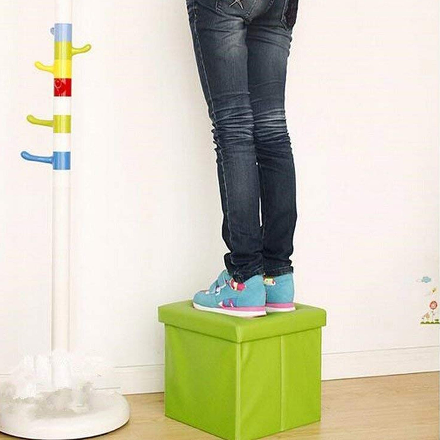 The foldable cube ottoman disassembled, illustrating its space-saving design for easy storage.