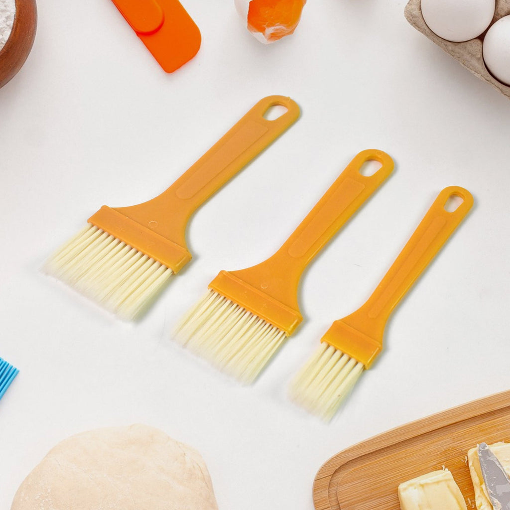 Three heat-resistant silicone basting brushes in various sizes for cooking and baking.