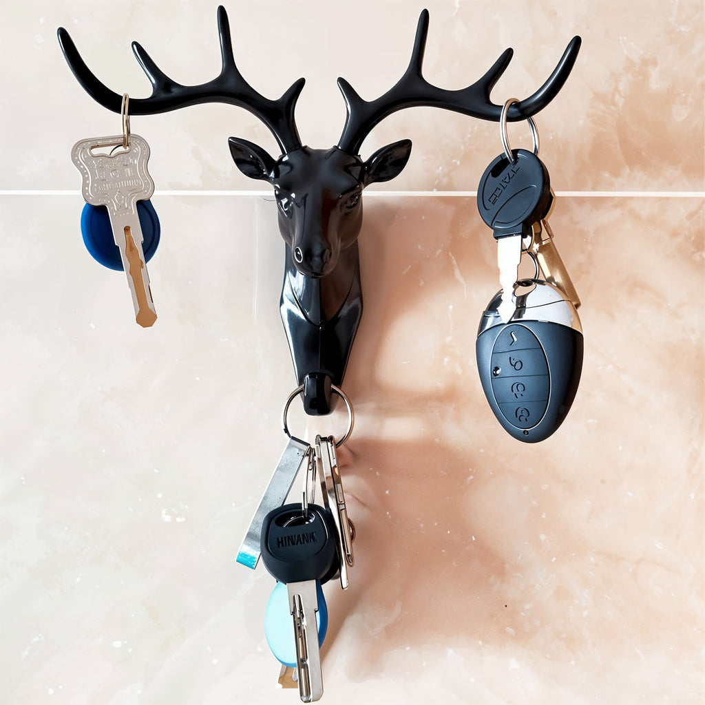 Close-up of the deer head wall hook, highlighting its detailed antlers and finish.