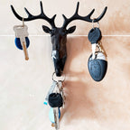 Close-up of the deer head wall hook, highlighting its detailed antlers and finish.