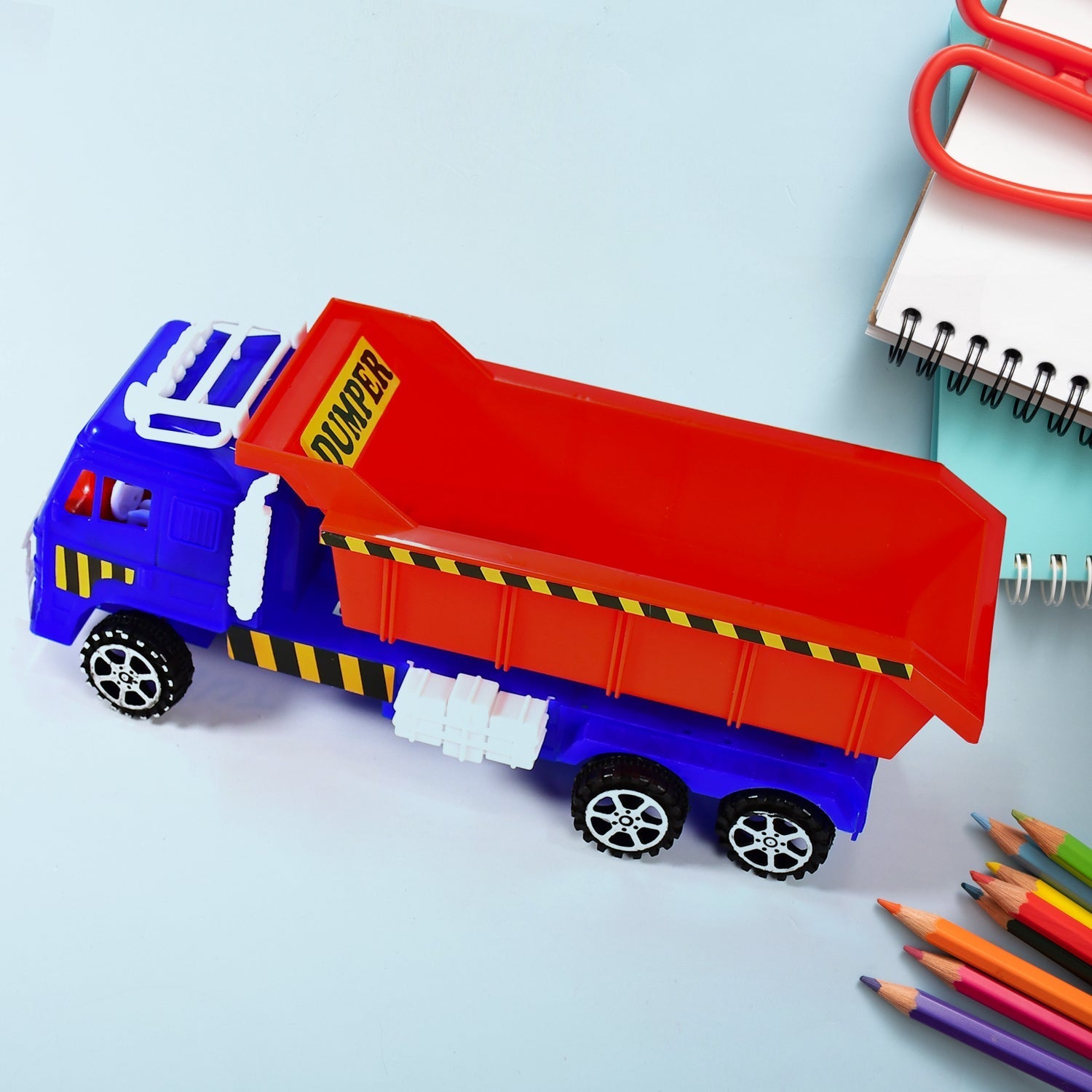Side view of a blue and yellow Friction Power Truck Toy for engaging play.