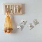 Back view of silver stainless steel hooks revealing their strong adhesive backing.