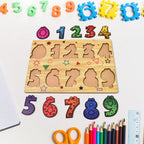 Wooden puzzle board displaying animal-shaped pieces with knobs