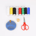 Sewing kit for home tailoring with bobbins, threads, and scissors.