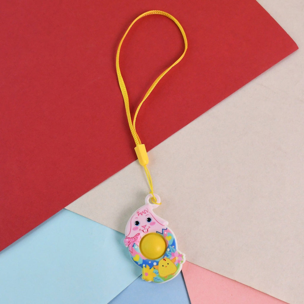 Mini chick-shaped push pop fidget toy with yellow hanging strap for stress relief