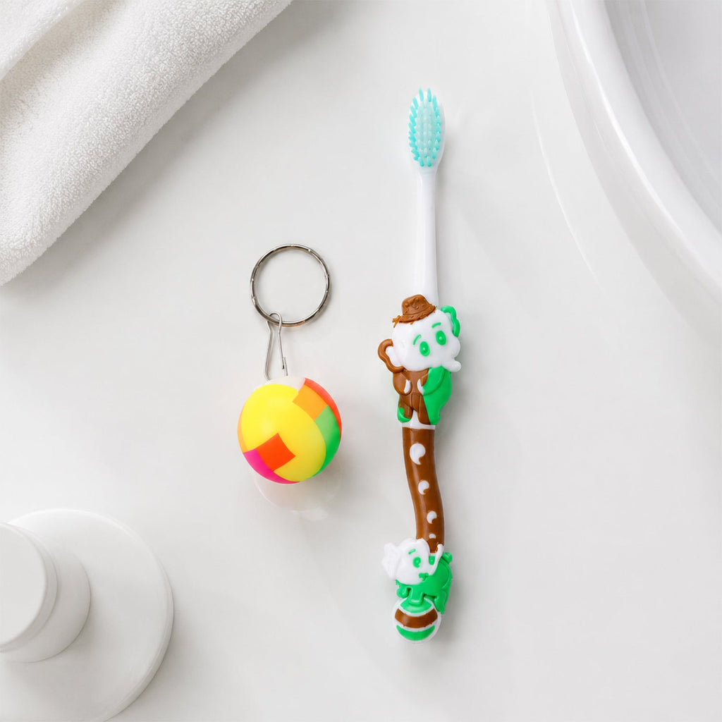 Front view of kids toothbrush and ball toy packaging with vibrant colors