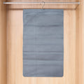 Foldable under garment organizer bag with multiple pockets hanging in closet