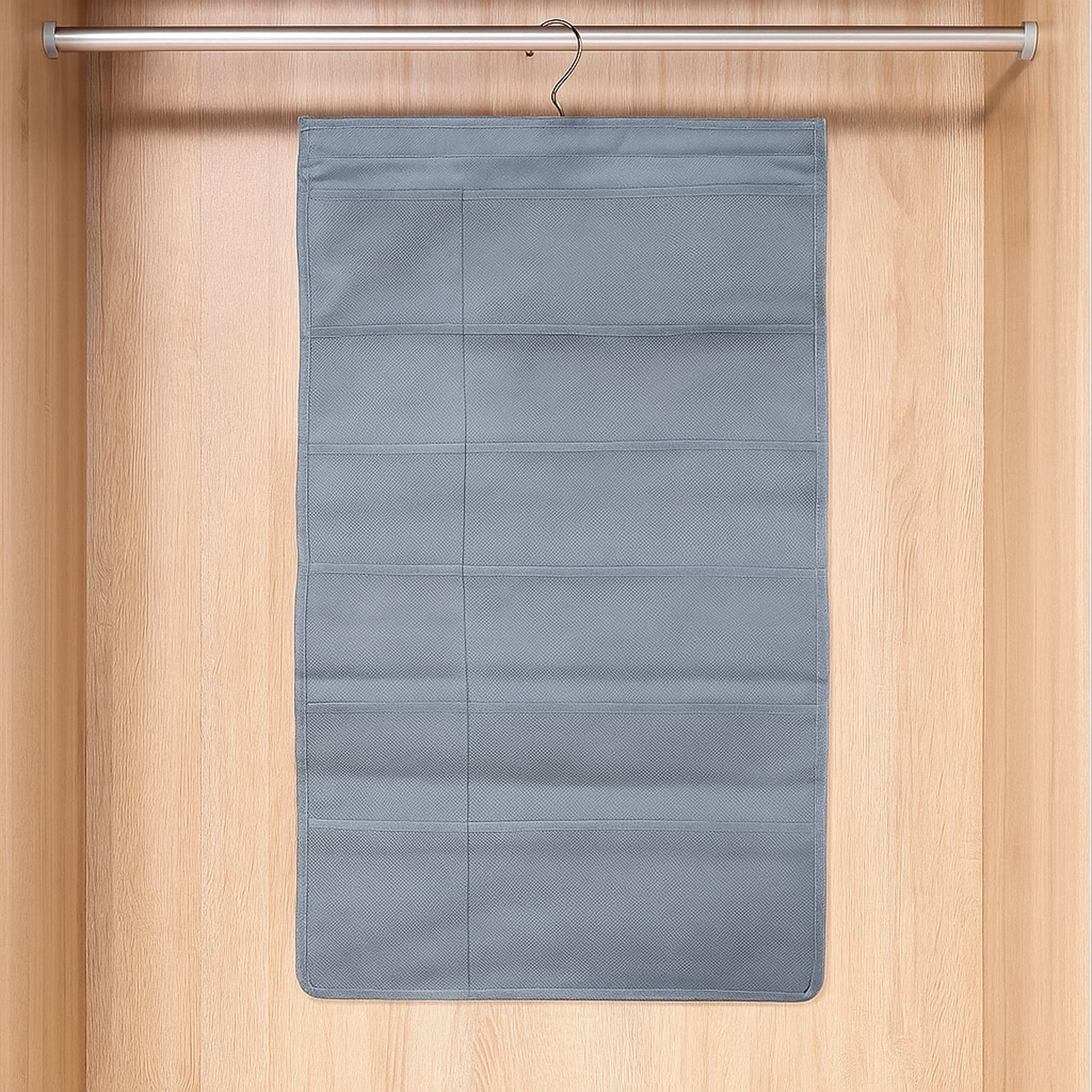 Foldable under garment organizer bag with multiple pockets hanging in closet