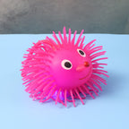 LED spiky puffer ball glowing in the dark with soft rubber texture