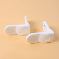 Baby safety cabinet lock securing corner of furniture