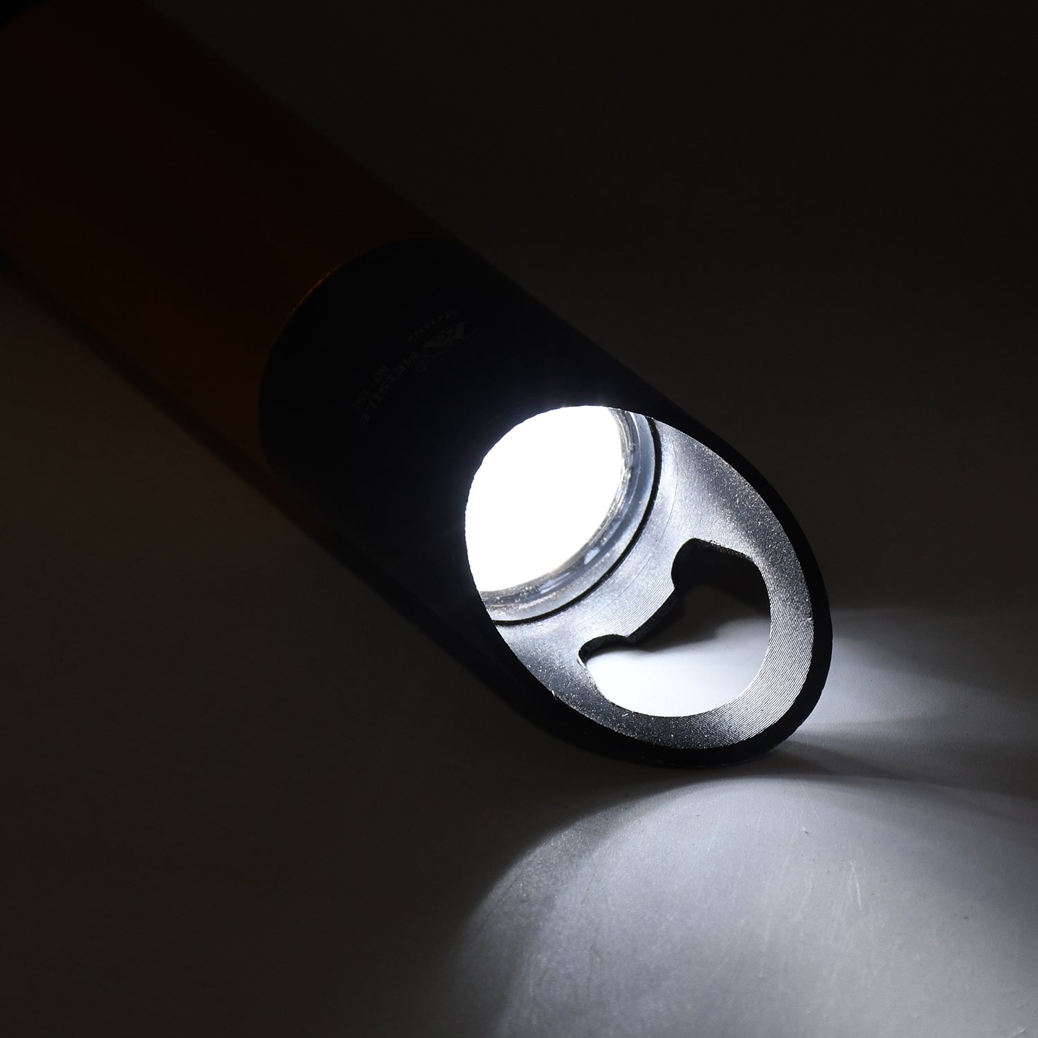 Mini LED torch illuminating a dark space, demonstrating its high lumen output.