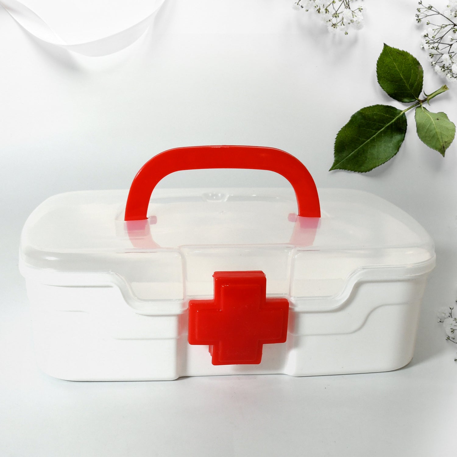 Side view of the portable medicine storage box, highlighting its compact design and integrated carrying handle.