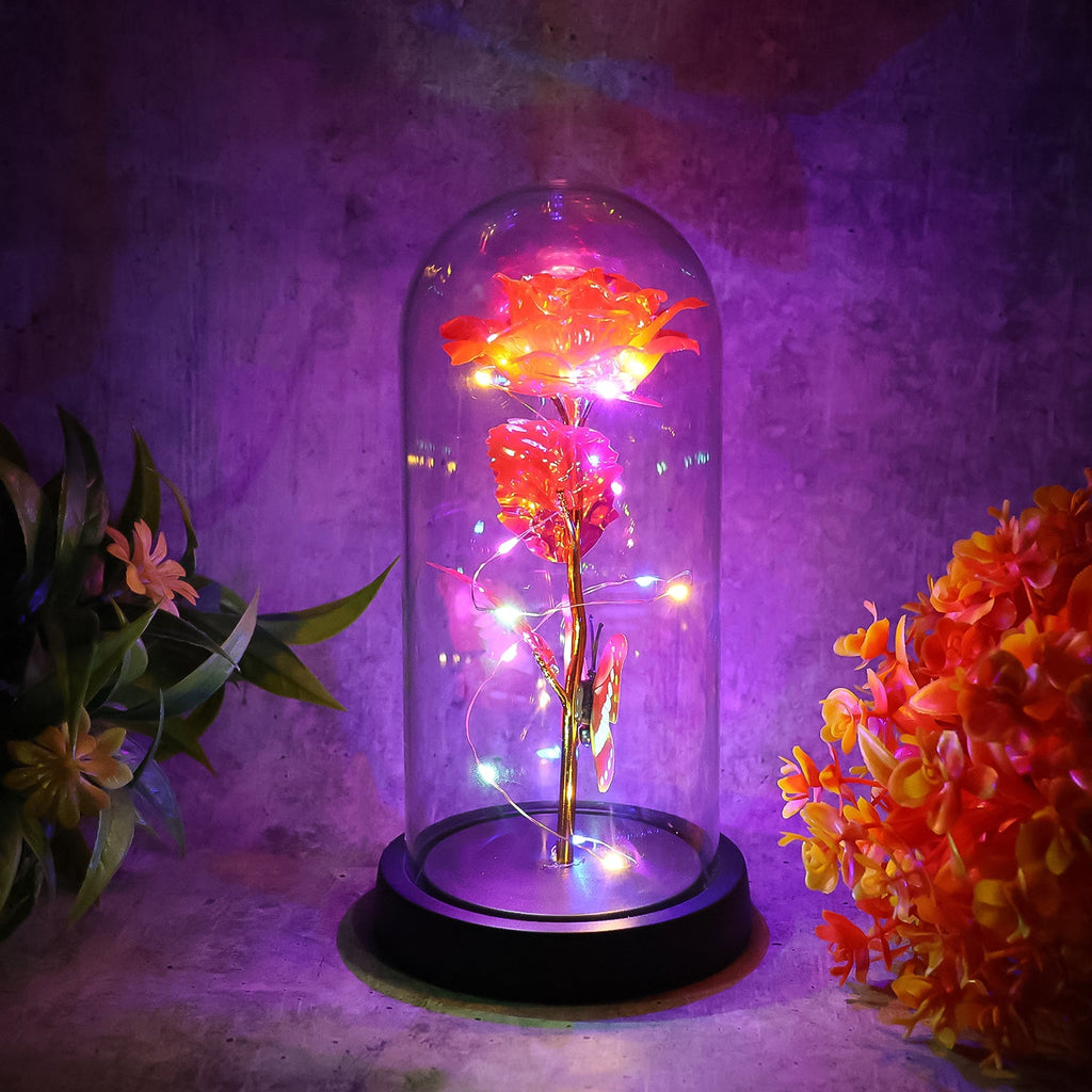 Close-up of LED eternal rose in plastic dome showing intricate details