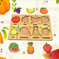 Wooden Fruit Puzzle board with colourful fruit shapes displayed on a white background.