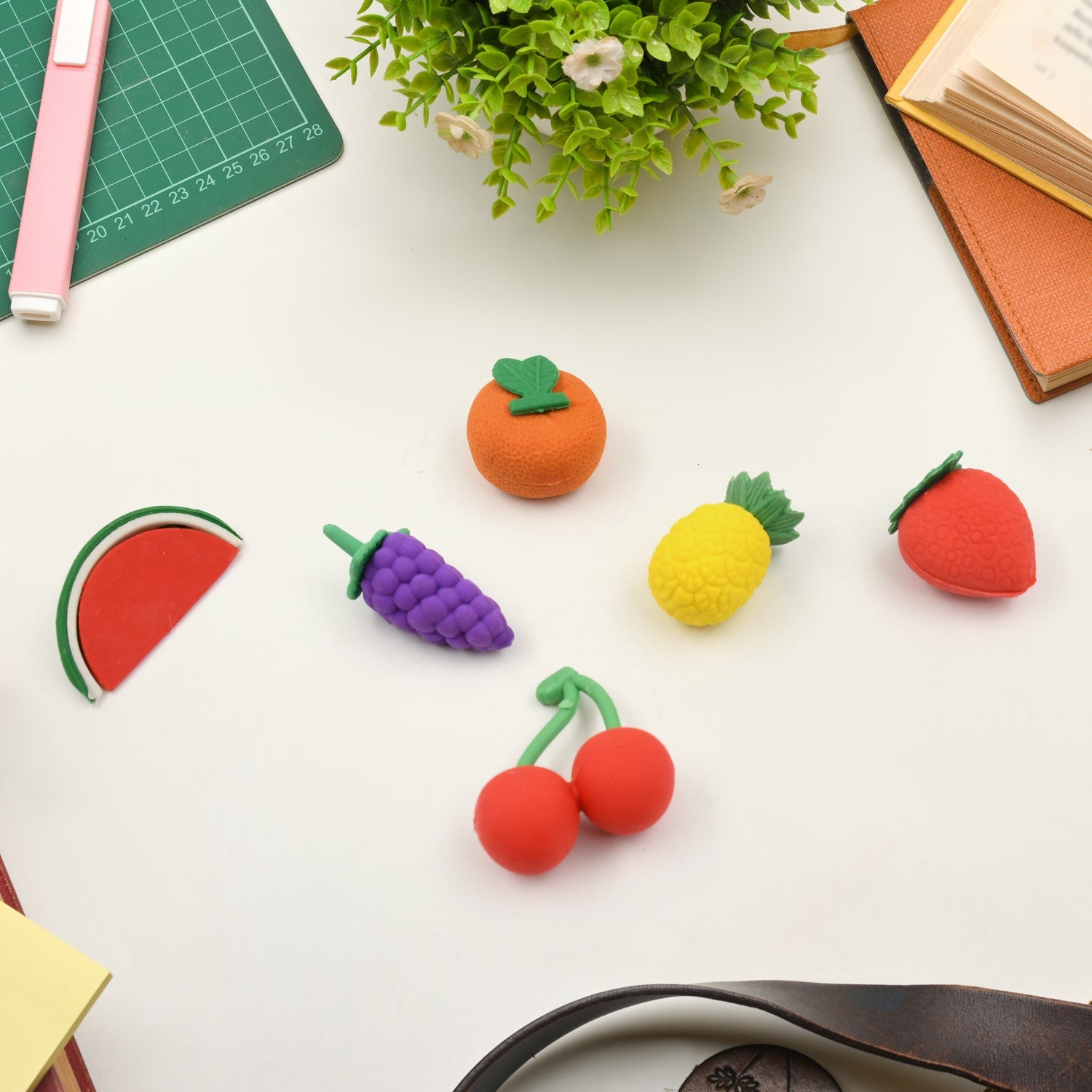 Assorted colourful 3D erasers displayed for children's school and play.