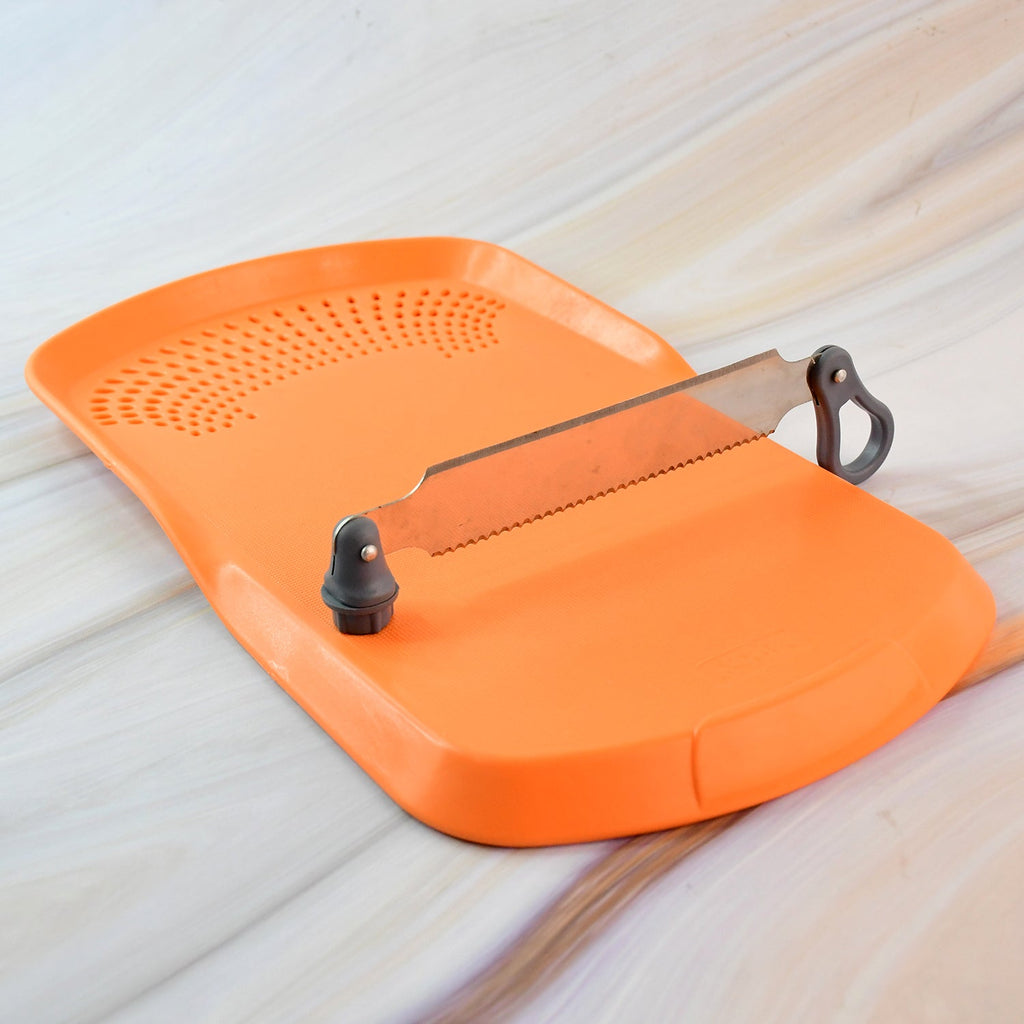 Apex Cut 'n' Wash cutting board with detachable stainless steel knife on surface