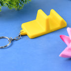 Dual-use mobile stand keychain showing portability and design