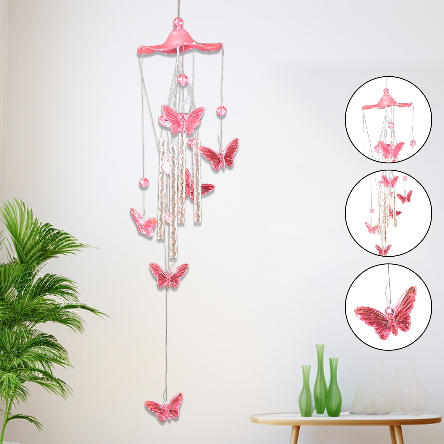 Butterfly Bell Wind Chimes swinging gently in a soft outdoor breeze