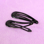 Metal hair clips displayed on white background showing assorted trendy colors