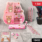 Open metal pencil box showing cartoon-themed school supplies including pencils and erasers