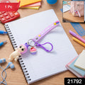Doll Cupcake keychain with a bright rainbow strap attached to keys