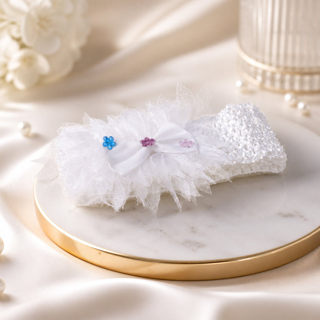 Comfortable floral baby headband worn on a baby's head