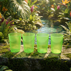Set of four transparent reusable plastic tumblers for daily use.