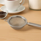 Supermom stainless steel mesh strainer featuring long handle