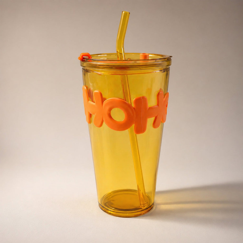 Trendy transparent glass tumbler with grip sleeve and straw