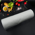 Eco-friendly reusable kitchen tissue sheets neatly rolled and packaged.