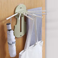 Ret retractable wall hanger with 7 hooks extended, shown from the front.