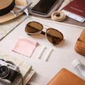 Travel-friendly sunglasses protection kit set with cleaning cloth and grips