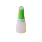 Ergonomic basting brush integrated with a clear silicone oil bottle.
