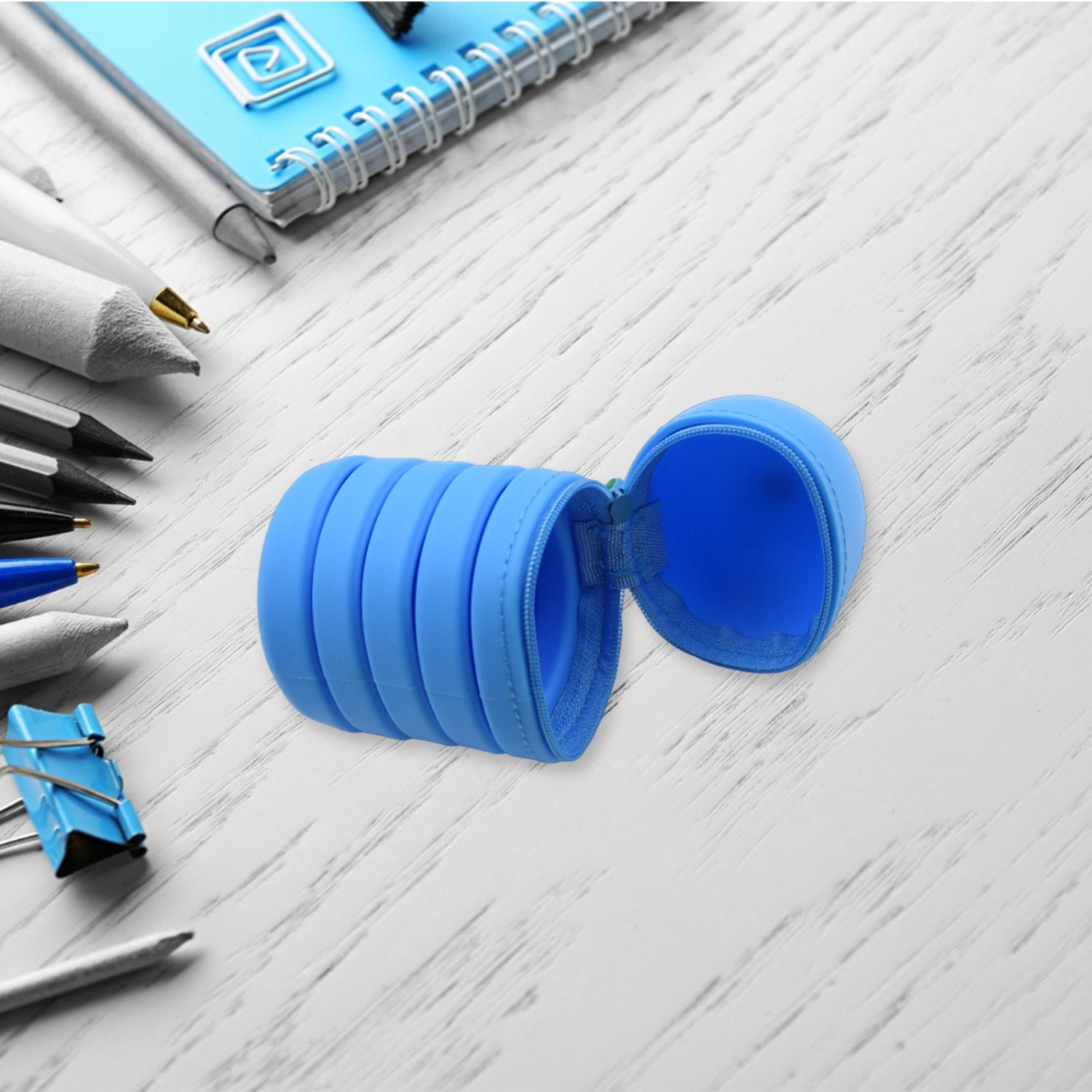A clear silicone telescopic pencil case, showcasing its versatile storage for all ages.