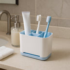 Side profile of a multi-purpose toothbrush caddy stand on a bathroom counter