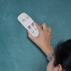 Magnetic duster conveniently placed on a whiteboard, ready for use.